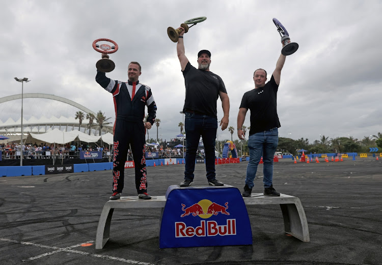 Jim McFarlane was crowned the winner of the Red Bull Car Drift championship at Suncoast Arena in Durban on Saturday. He is flanked by Christopher Long and Juan Stemmet.