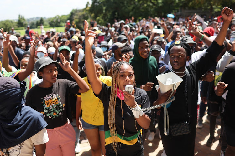 Students gather outside the University of the Witwatersrand's Great Hall in Johannesburg on March 2 2023, to protest the exclusion of students who are unable to pay historical debt.