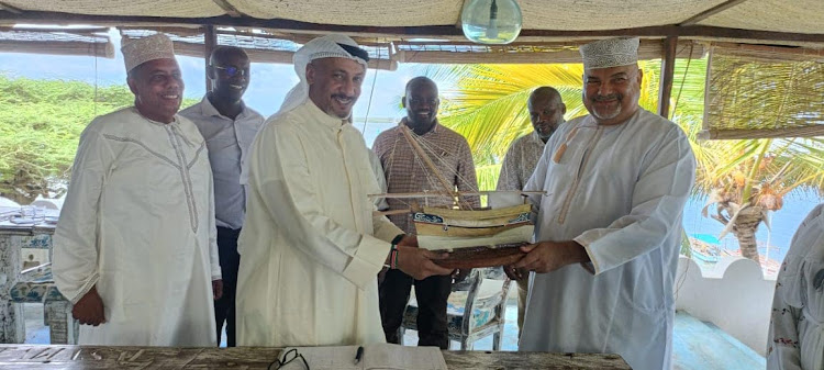 Lamu Governor Fahim Twaha gifts Kuwait Ambassador to Kenya Qusai Rashed Al Farhan a dummy boat when he hosted him.