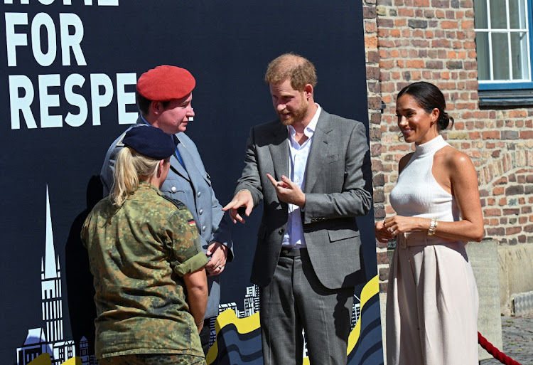 Prince Harry and Meghan Markle talk to soldiers in Dusseldorf ahead of the 2023 Invictus Games.