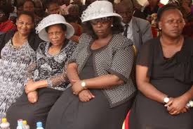 Too's widows Sophie (second right) and Mary during his burial