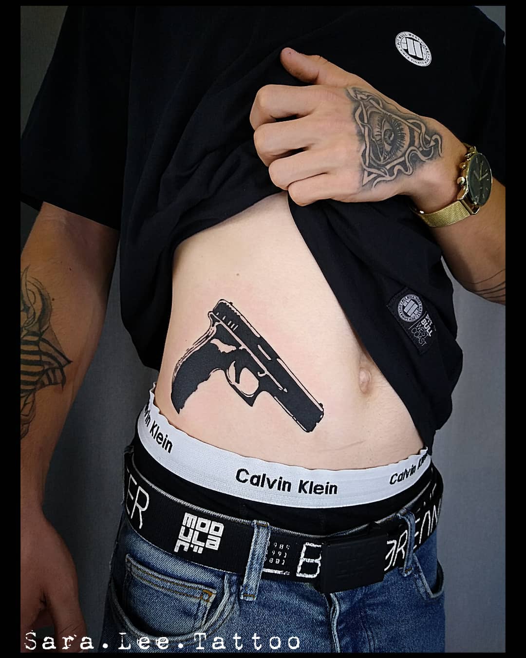 Black Gun Tattoo On Waist