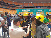 Three  firemen ran last year's  Soweto Marathon  in honour of co-workers who died in a blaze. /Jetline Photography