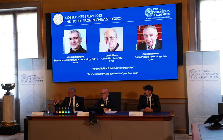 Hans Ellegren, centre, permanent secretary of the Royal Swedish Academy of Sciences, announces the winners of the 2023 Nobel Prize in Chemistry in Stockholm, Sweden, October 4 2023. This year's prize was awarded to Moungi Bawendi, Louis Brus, and Alexei Ekimov. Picture: TOM LITTLE/REUTERS