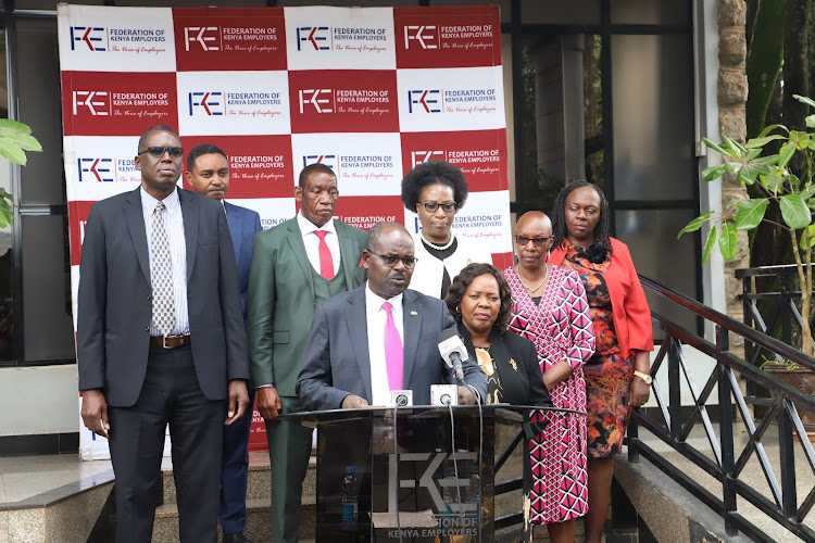 Federation of Kenya Employers national president Habil Olaka with the federation’s CEO Jacqueline Mugo and FKE board members, during a press briefing at the FKE headquarters in Nairobi, on November 24/ HANDOUT