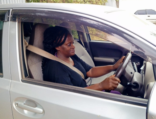 Digital taxi driver Nelly Mutahi in her ride.