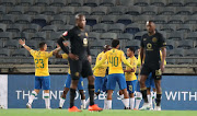 Leandro Sirino of Mamelodi Sundowns celebrates goal with teammates during the Absa Premiership match between Kaizer Chiefs and Mamelodi Sundowns at Orlando Stadium on August 27, 2020 in Johannesburg, South Africa. 