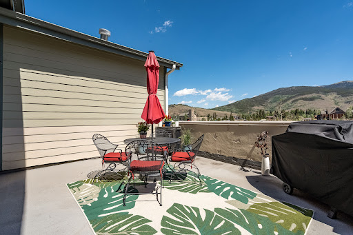 Terrace with table, chairs and barbecue in this luxury property for sale in Dillon ($875,000)