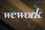 The WeWork logo is displayed on the entrance of a co-working space in New York City, New York US. 