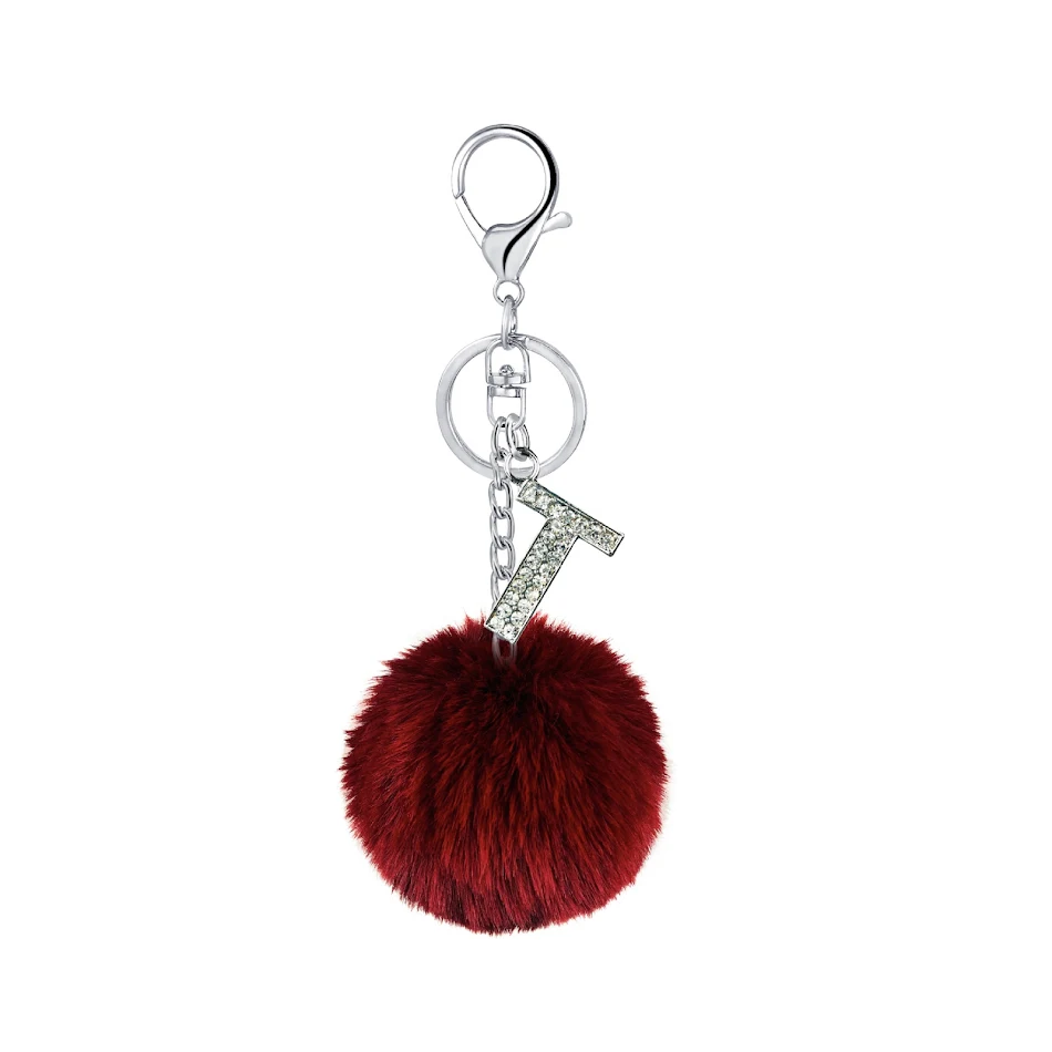 Sleutelhanger met 26 kleuren Rex konijnenbont bal diamant Engelse letters. Stijlvol en personaliseerbaar voor sleutels of tas.