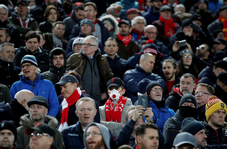 A Liverpool fan wearing a face mask at Anfield during the Champions League clash between Liverpool and Atletico Madird