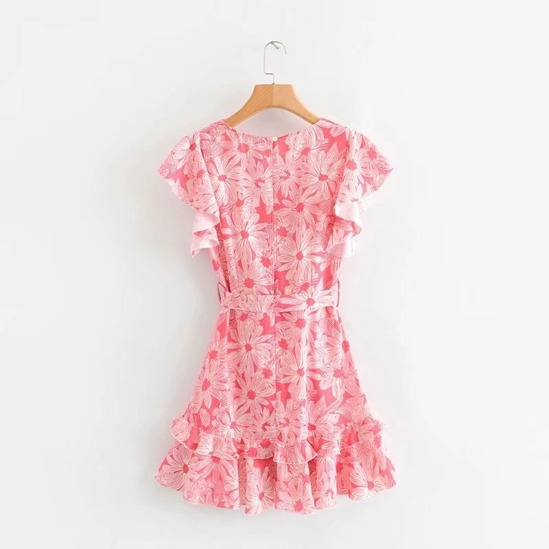 Abito estivo con scollo a V, balze, pizzo e stampa floreale. Perfetto per un look fresco e femminile in estate.