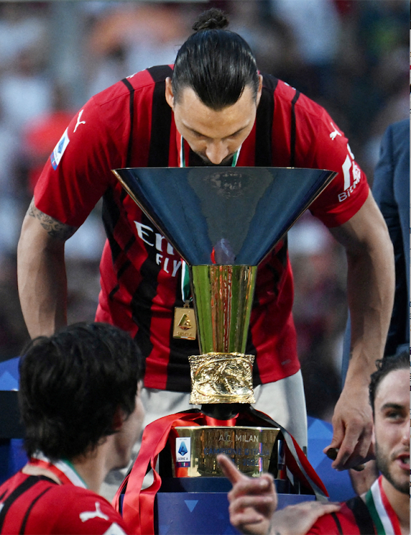 AC Milan's Zlatan Ibrahimovic celebrates with the trophy lift after winning the Serie A