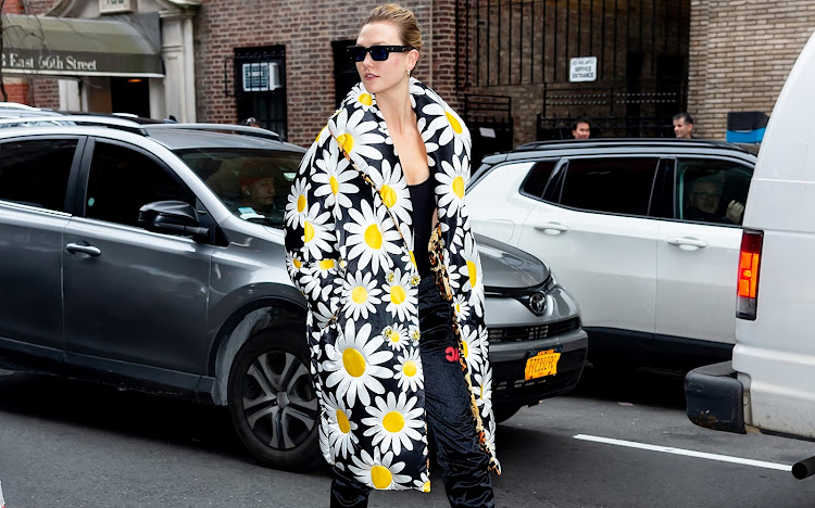 Karlie Kloss spotted at NYFW 2020 donning a bold printed jacket.