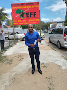 A soccer fan poses for a photo after collecting his ticket at the EFF offices in Polokwane for a 2018 FIFA must-win Russia World Cup qualifier against Senegal at Peter Mokaba Stadium. 