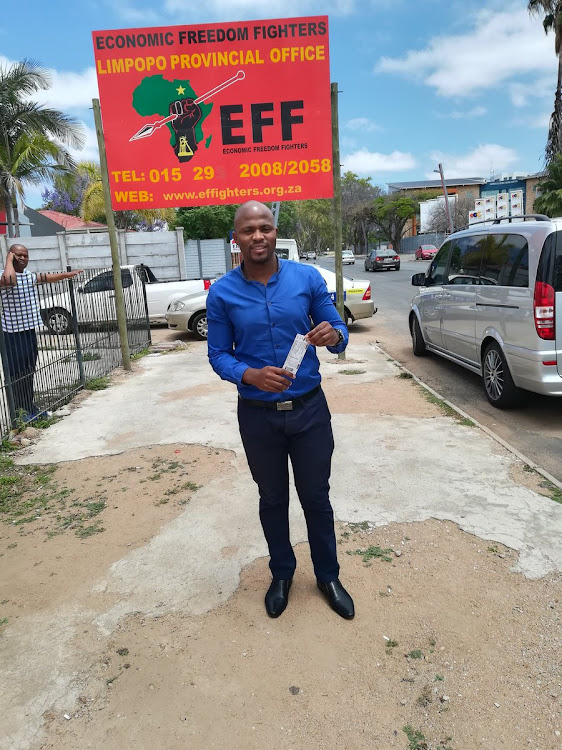 A soccer fan poses for a photo after collecting his ticket at the EFF offices in Polokwane for a 2018 FIFA must-win Russia World Cup qualifier against Senegal at Peter Mokaba Stadium.