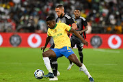 Teboho Mokoena of Mamelodi Sundowns is challenged by Miguel Timm of Orlando Pirates in the MTN8 final at Moses Mabhida Stadium on Saturday.