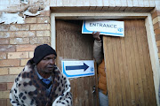 Seventeen voting stations - fourteen of them in KwaZulu-Natal -  remained closed on election day, IEC CEO Sy Mamabolo said on Wednesday. In this image, a voter at Sebokeng Hostel shielded themselves with blankets as they faced braved the early morning chill to cast their votes.