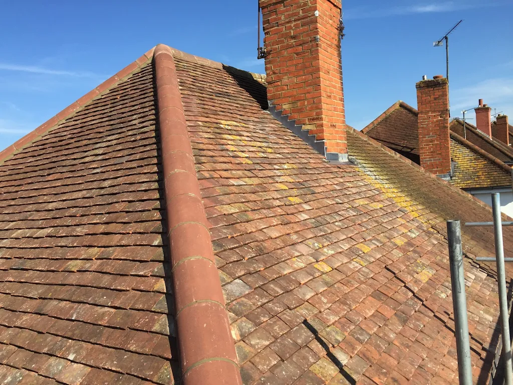 stripped of old tiles, refelt and battend roof and reinstated original tiles