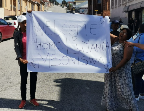 Family members of Luyanda Mboniswa prepared a 'welcome home' banner for him as he was released from prison on Wednesday.