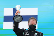 Third placed Valtteri Bottas of Finland and Mercedes GP celebrates on the podium during the F1 Grand Prix of Spain at Circuit de Barcelona-Catalunya on August 16 2020 in Barcelona, Spain.