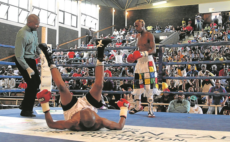 A file photo of Loyiso Velleman from Border Post after he sent Nasiphi Ndlangazi of Mdantsane crashing to the canvas during their junior bantamweight six-rounder. The match was handled by Allan Matakane.