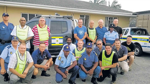 UNITED FORCE: Members of the Beacon Bay Sector Patrollers Forum and police, who will work together to stamp out crime Picture: SUPPLIED