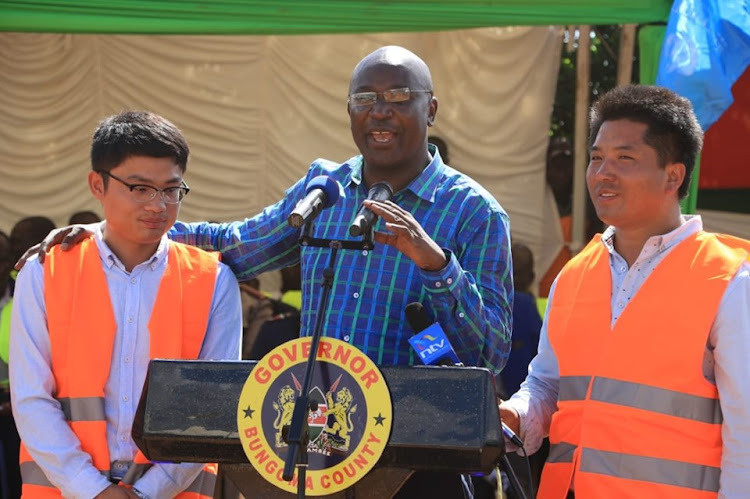 Bungoma Governor Wyclife Wangamati with the Chinese contractors