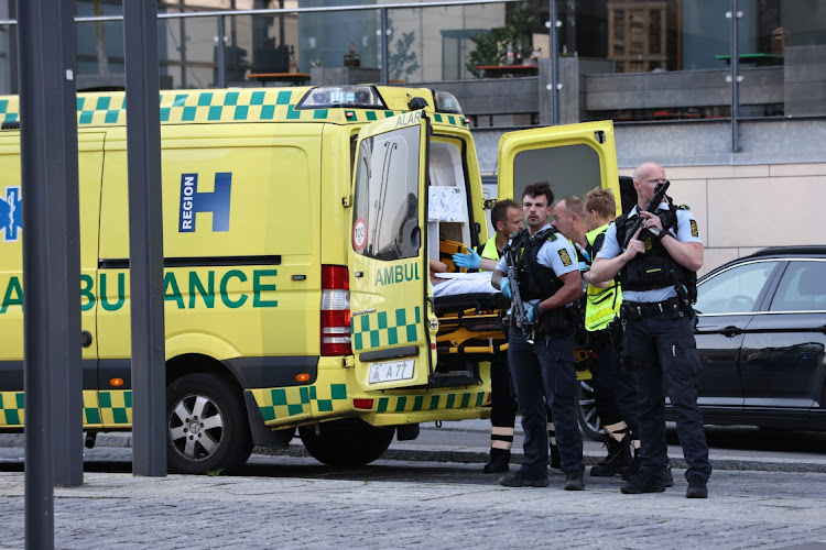 An ambulance and armed police stand outside Field's shopping centre, after Danish police said they received reports of shooting, in Copenhagen, Denmark, on July 3, 2022. Ritzau Scanpix/Olafur Steinar Gestsson via REUTERS ATTENTION EDITORS - THIS IMAGE WAS PROVIDED BY A THIRD PARTY. DENMARK OUT. NO COMMERCIAL OR EDITORIAL SALES IN DENMARK.