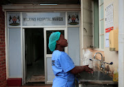 A health worker washes her hands during a demonstration of preparations for coronavirus cases at a hospital in Harare, Zimbabwe, on March 11 2020. 