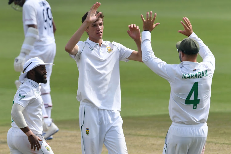 Marco Jansen celebrates the wicket of Rishabh Pant with teammates Temba Bavuma and Aiden Markram on the first day of the second Test against India at the Wanderers in Johannesburg.