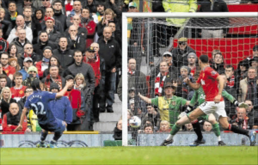 THE EQUALISER: Steven Pienaar of Everton scores his team's fourth goal during the Barclays Premier League match against Manchester United at Old Trafford yesterday. Photo: Alex Livesey/Getty Images