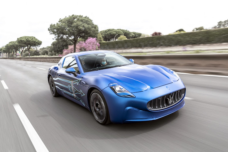 Stellantis CEO Carlos Tavares shows off a prototype of the Maserati's first electric car, the GranTurismo Folgore. Picture: SUPPLIED