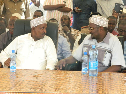 National assembly majority leader Aden Duale with Bura MP Ali Wario during a fund drive in Bangale division,Bura constituency on Sunday.they vowed to defend embattled IEBC commissioners.Photo Stephen Astariko