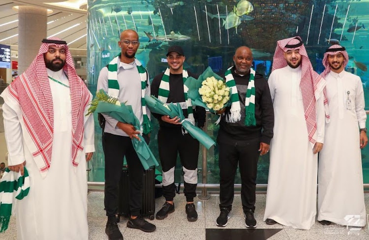 Head coach Pitso Mosimane (third from right) and performance analysts Musi Matlaba (second from left) and Kyle Solomon (centre) are greeted by officials of their new club Al-Ahli Saudi FC on arrival at King Abdulaziz International Airport in Jeddah, Saudi Arabia.