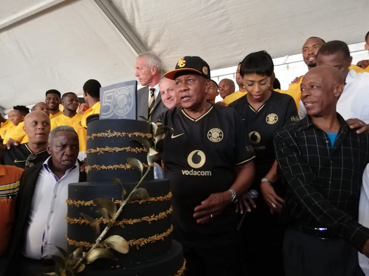 Kaizer Chiefs boss Kaizer Motaung stands in front of the club's birthday cake during their 50th anniversary celebration in Soweto on January 7 2020.