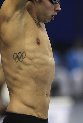 A detail of an Olympic rings tattoo on the torso of Nick Drebergen of the Netherlands prior to the first heat of the Men's 100m Backstroke semifinal during Day Ten of the 14th FINA World Championships at the Oriental Sports Center on July 25, 2011 in Shanghai, China