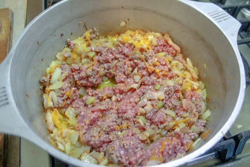 Ground Beef And Ground Pork Added To The Dutch Oven.