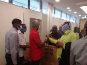 Relatives talk to Dylan and Ned Govender after they were refused bail in the Verulam magistrate's court on Thursday.