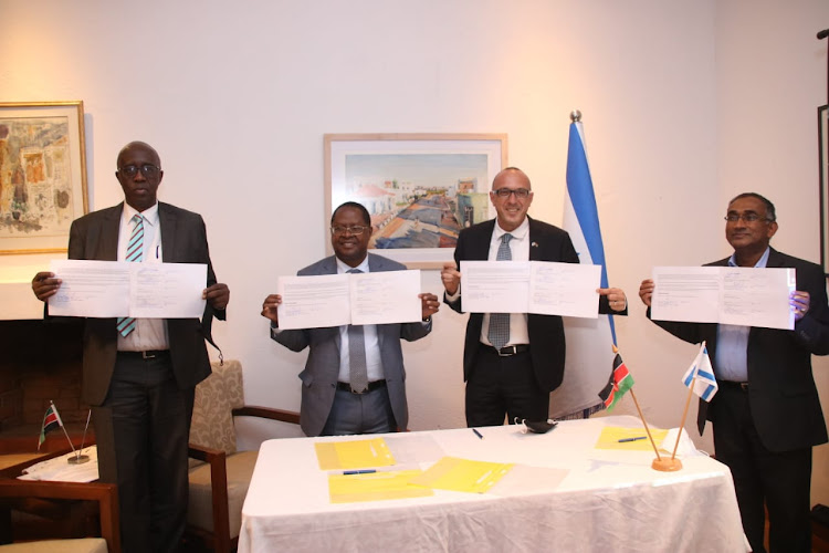 Regional Director Syngenta Foundation EA George Osure, Embu Governor Martin Wambora, Israel Ambassador Oded Joseph and Fr George Tharaniyil, the Executive Director of Don Bosco Tech Africa during the signing of an MoU in Nairobi on Wednesday, March 24, 2021