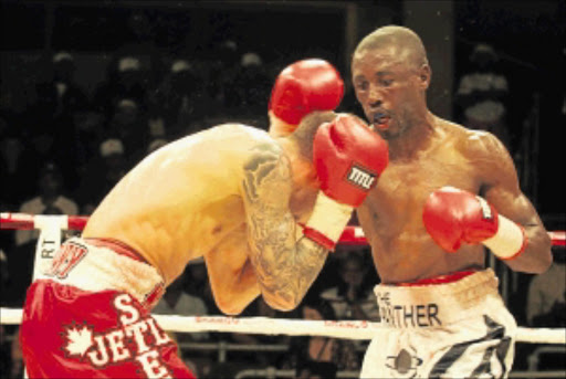 STUNNING TRIUMPH: IBF junior featherweight champion Takalani 'Panther' Ndlovu on the attack against Steve Molitor during their clash at the Nasrec Indoor Arena in Soweto earlier this year. Photo: Bafana Mahlangu