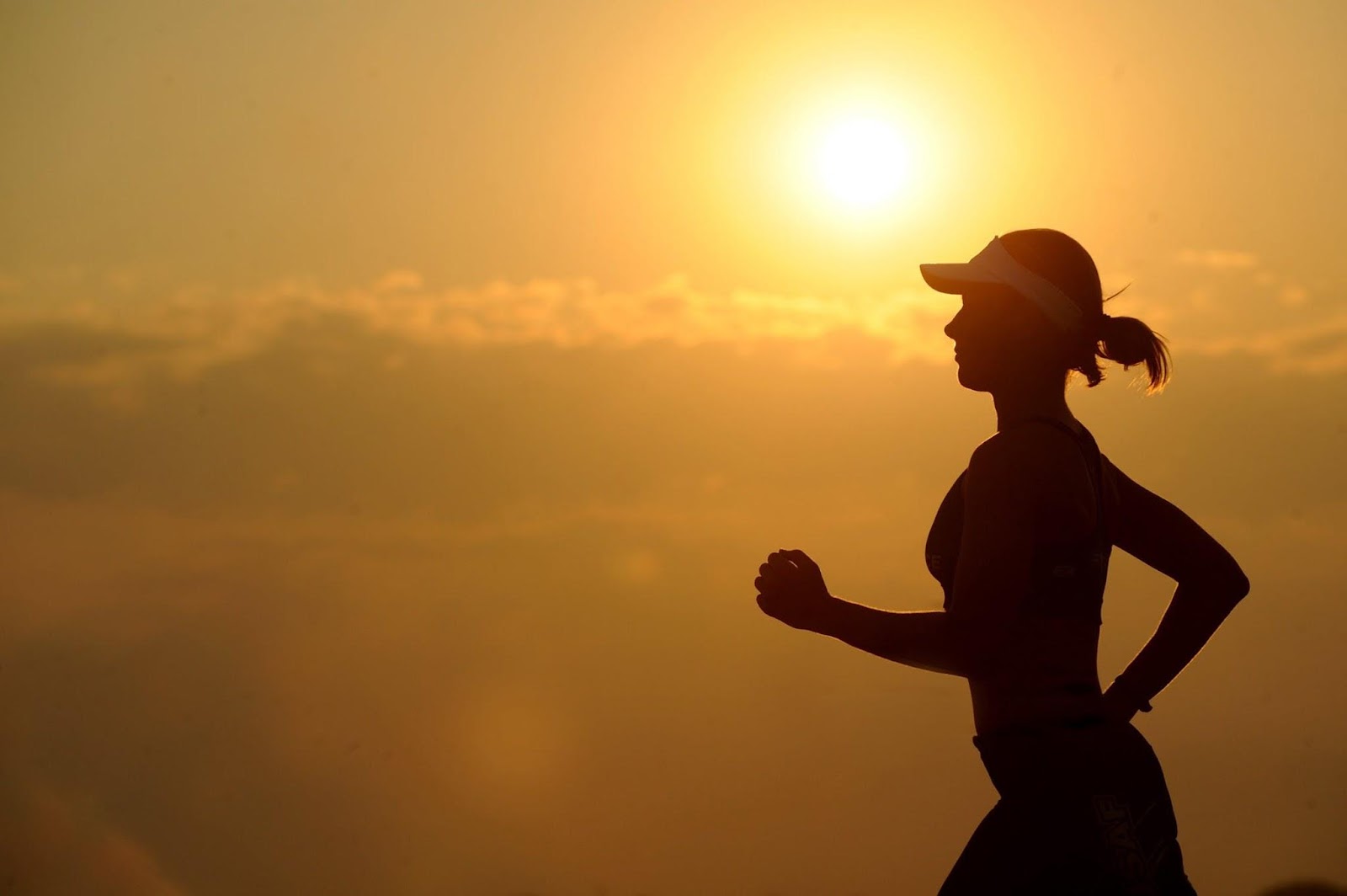 Image of woman running at first light