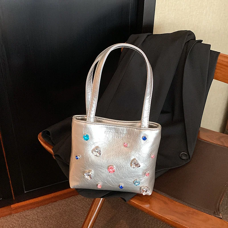 Draagbare damestas met niche-textuur en strass. Stijlvol en compact, ideaal voor dagelijks gebruik of speciale gelegenheden. Een modieuze accessoire.