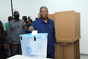 Angola's President and leader of the People's Movement for the Liberation of Angola (MPLA) ruling party Joao Lourenco casts his vote in a general election in the capital Luanda, Angola August 24, 2022.