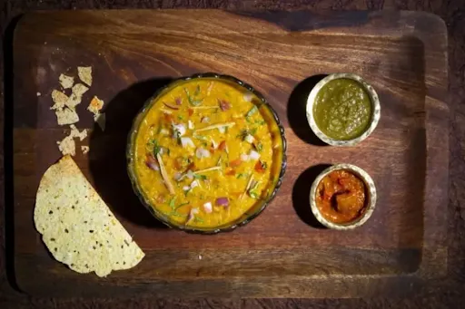 Moong Dal Khichdi Served With Achar And Papad,