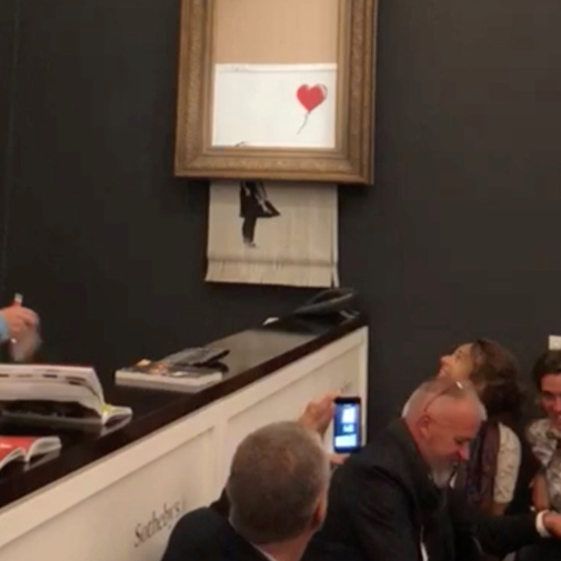 Banksy’s painting “Girl with Red Balloon” is seen shredded after its sale at Sotheby auction in London on October 5, 2018. Picture: INSTAGRAM/@PIERREKOUKJIAN and INSTAGRAM/@SINCEFINEART via REUTERS