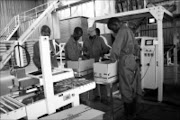 BACK TO NORMAL: Workers at Tshivhase Tea Estate pack tea into boxes for export and the local market as the company prepares to become profitable again. 16/04/09. Pic. Chester Makana. © Sowetan.