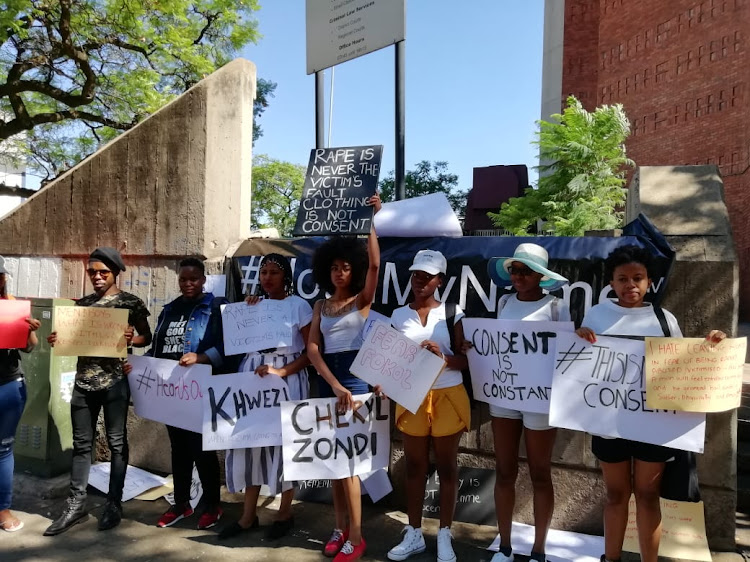 Demonstrators against gender-based violence protest outside the Pretoria Magistrate's Court on Friday.