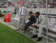 Ari Efstathiou, Chairman of Ajax Cape Town (l) and Stanley Menzo, Head Coach of Ajax Cape Town (r) during the Absa Premiership 2016/17 football match against Cape Town City FC at Cape Town Stadium on 11 February 2017.