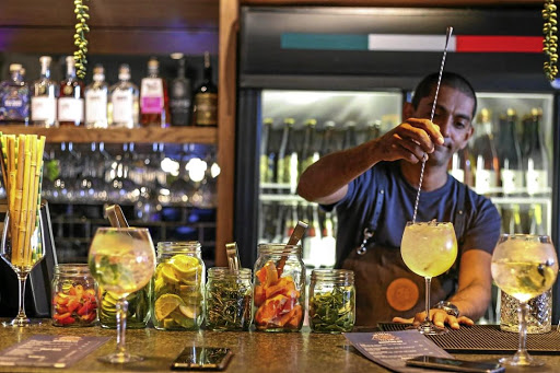 Haroon Haffajee mixes a gin-base cocktail at The Secret Gin Bar in Durban North.